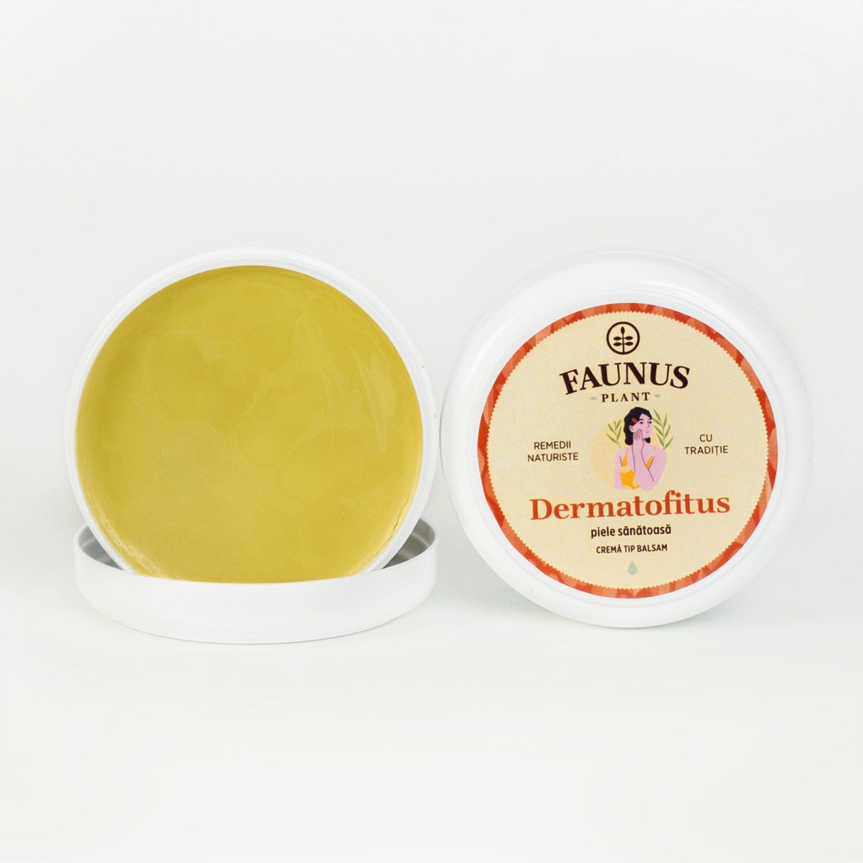 Cutie deschisă a unguentului Dermatofitus 100ml de la Faunus Plant, care expune textura unguentului, de culoare galbenă, și capacul cu eticheta ilustrată. Pe etichetă apare logo-ul Faunus Plant, denumirea produsului „Dermatofitus – Piele sănătoasă” și specificația „Cremă tip balsam”.