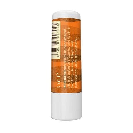 Vedere laterală stânga a Balsamului de Buze cu Portocale de la Faunus Plant, cu eticheta vizibilă care conține informații despre compoziția produsului, incluzând ingrediente precum ulei de măsline, gălbenele, ceară de albine, ulei esențial de portocală, respectiv vitamina E.